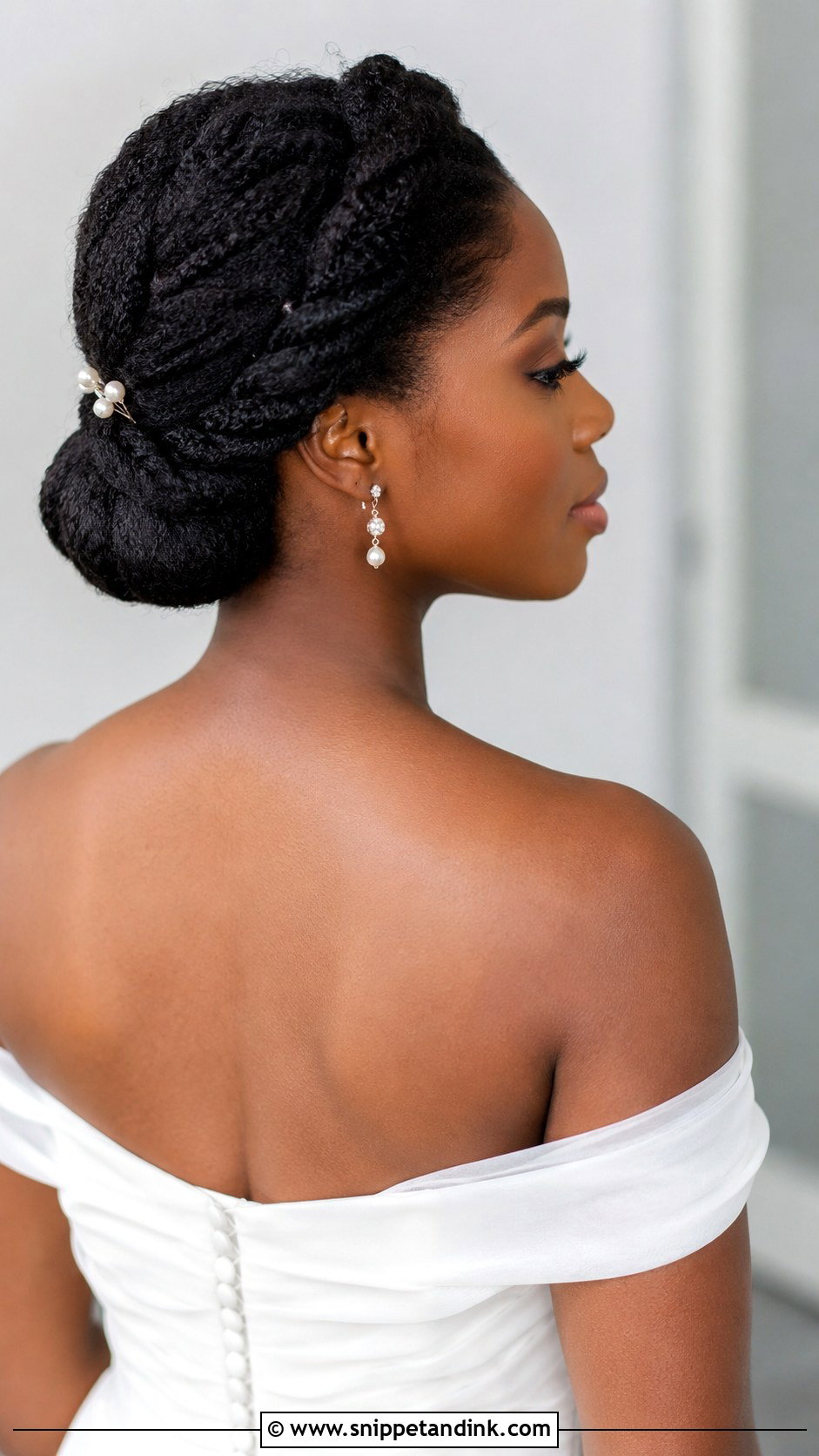 Twisted Low Bun - Snippet and Ink - 25 Afro Wedding Hairstyles