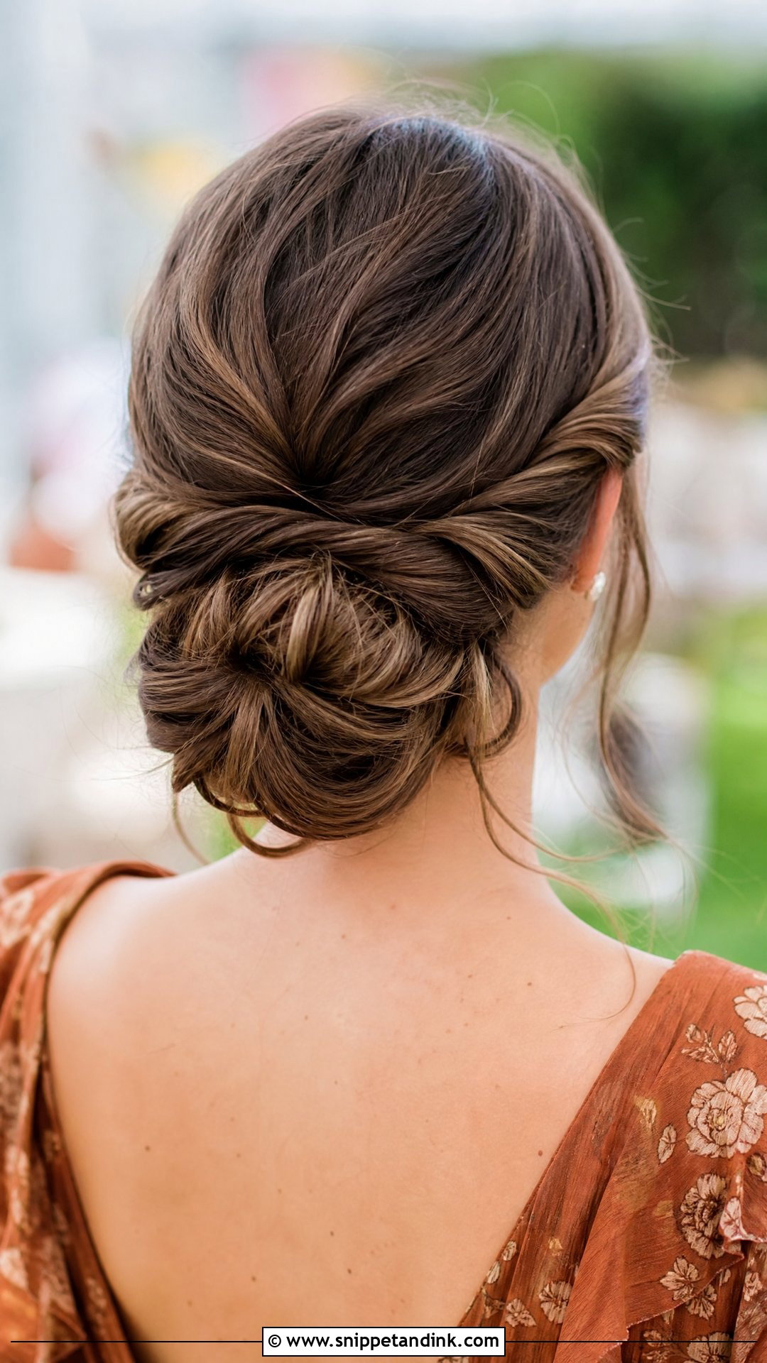 Twisted Low Bun - Snippet and Ink - 30 Medium Wedding Guest Hairstyles