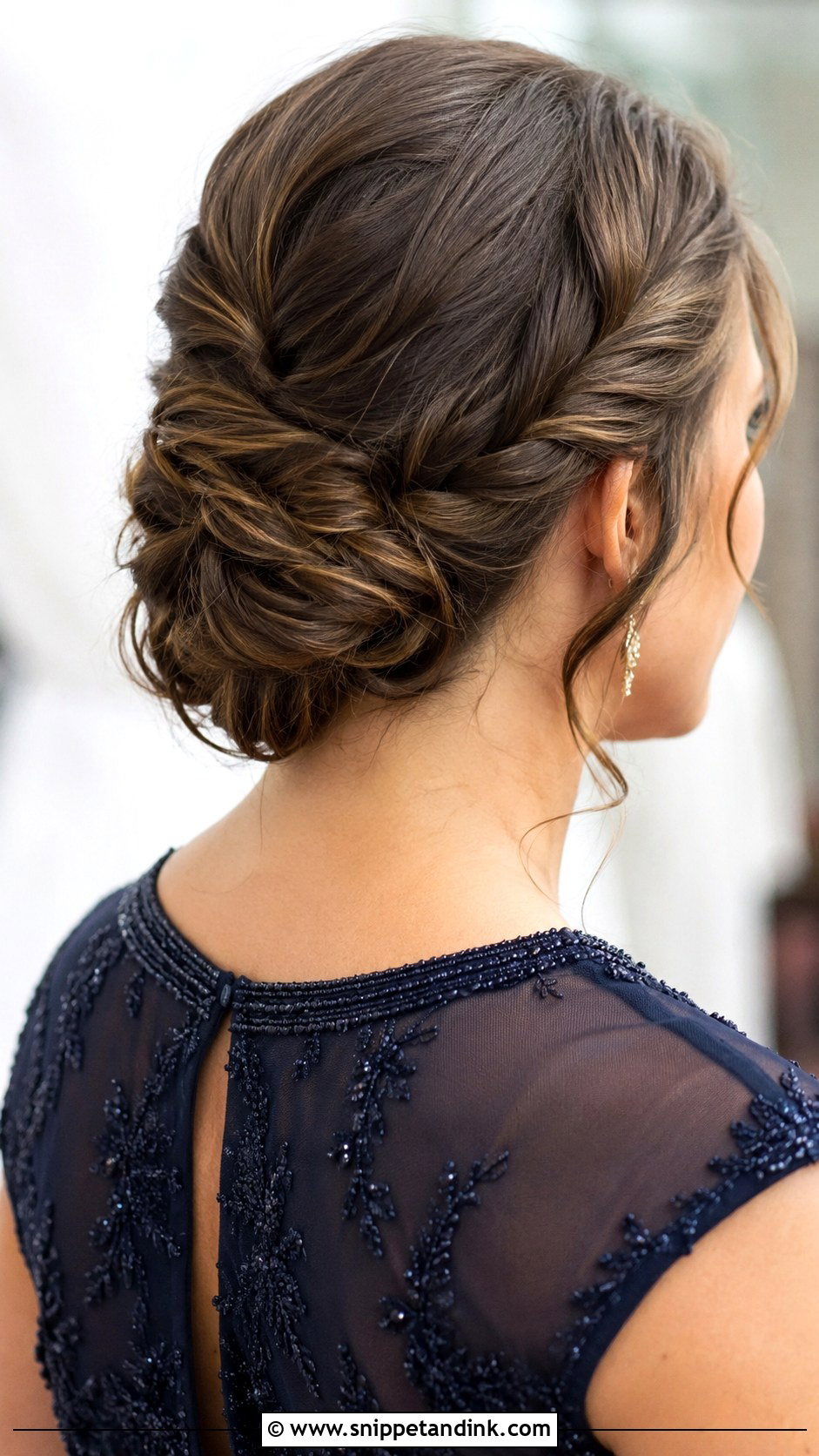 Twisted Low Bun - Snippet and Ink - 30 Wedding Guest Hairstyle Ideas