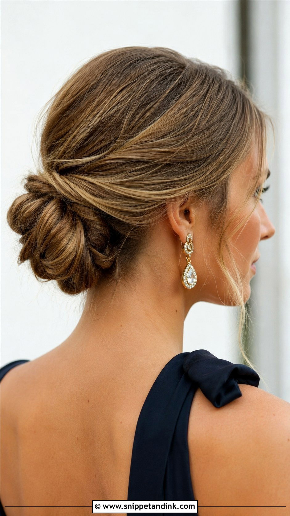 Twisted Low Bun - Snippet and Ink - 20 Easy Wedding Guest Updo Hairstyles