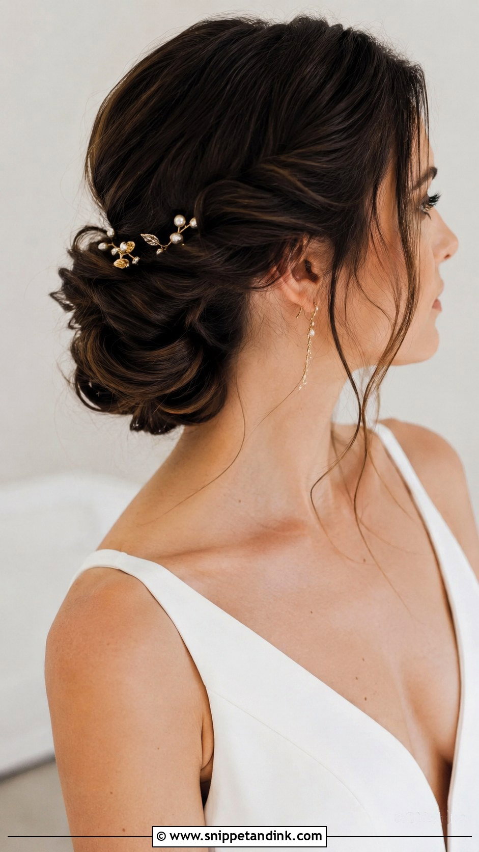 Twisted Low Bun With Loose Strands - Snippet and Ink - 20 Wedding Hairstyles Dark Hair