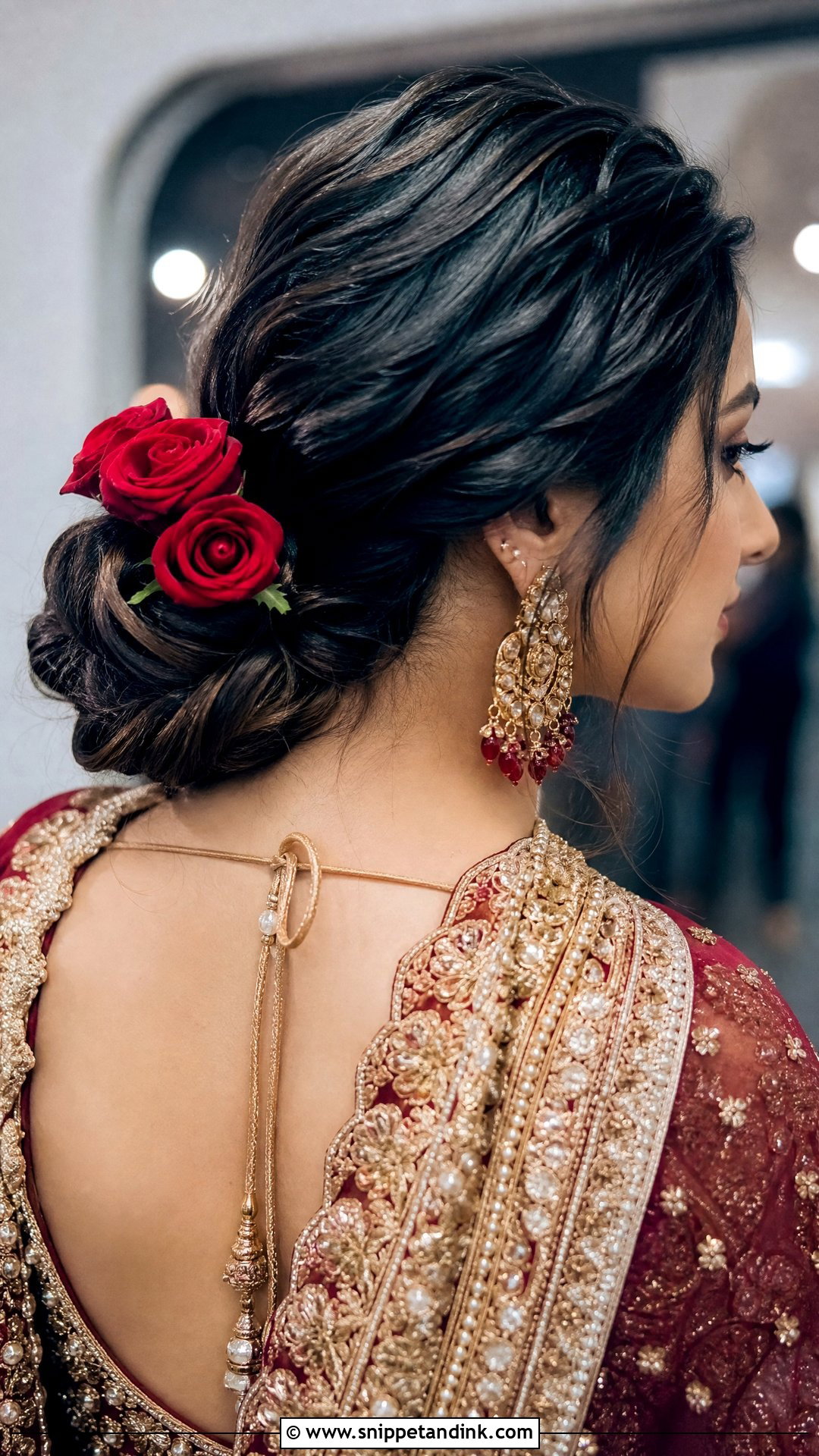 Twisted Low Bun With Rose Accents - Snippet and Ink - 20 Pakistani Bridal Hairstyles Nikah