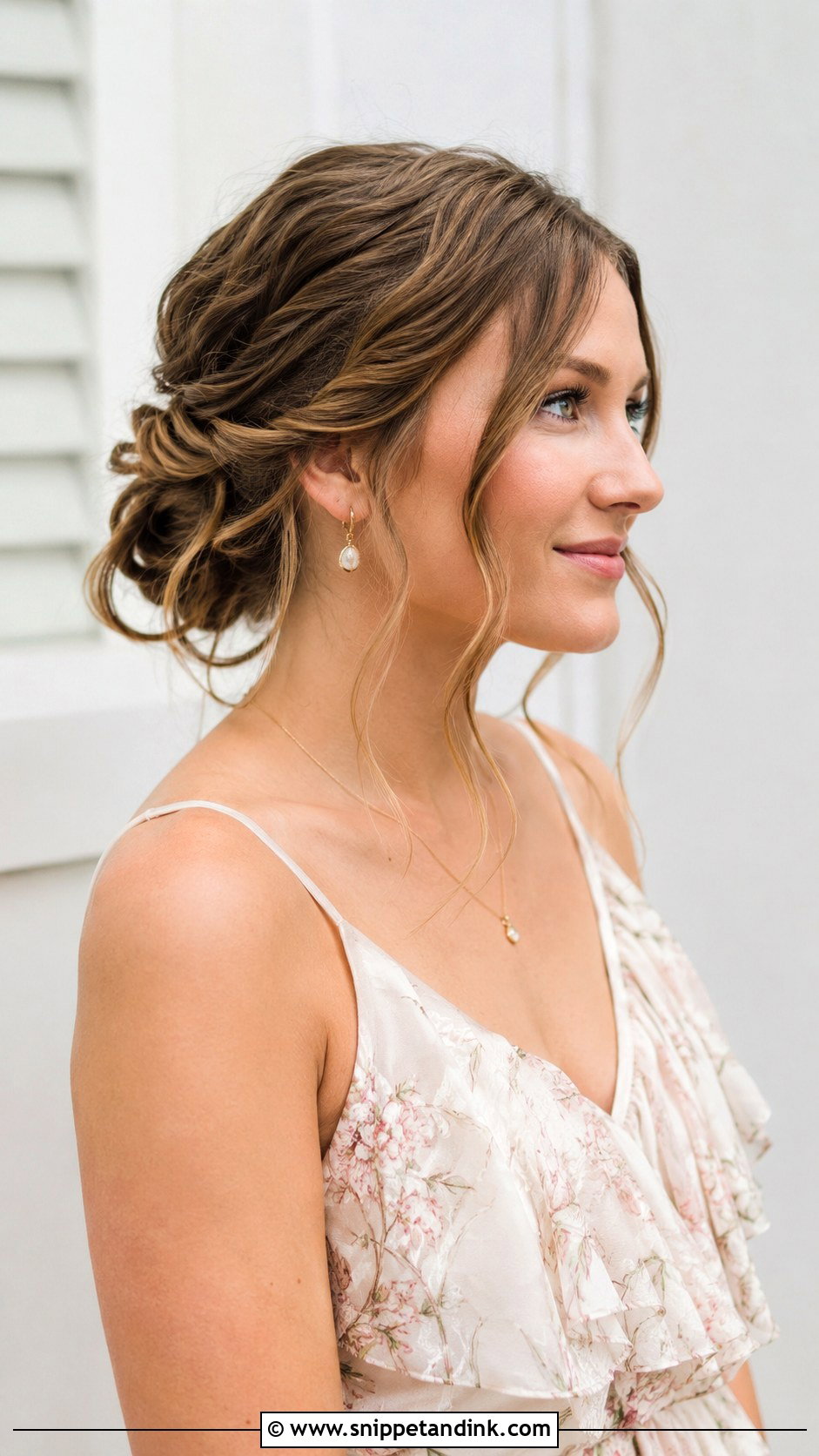 Twisted Low Bun With Tendrils - Snippet and Ink - 20 Summer Wedding Guest Hairstyles