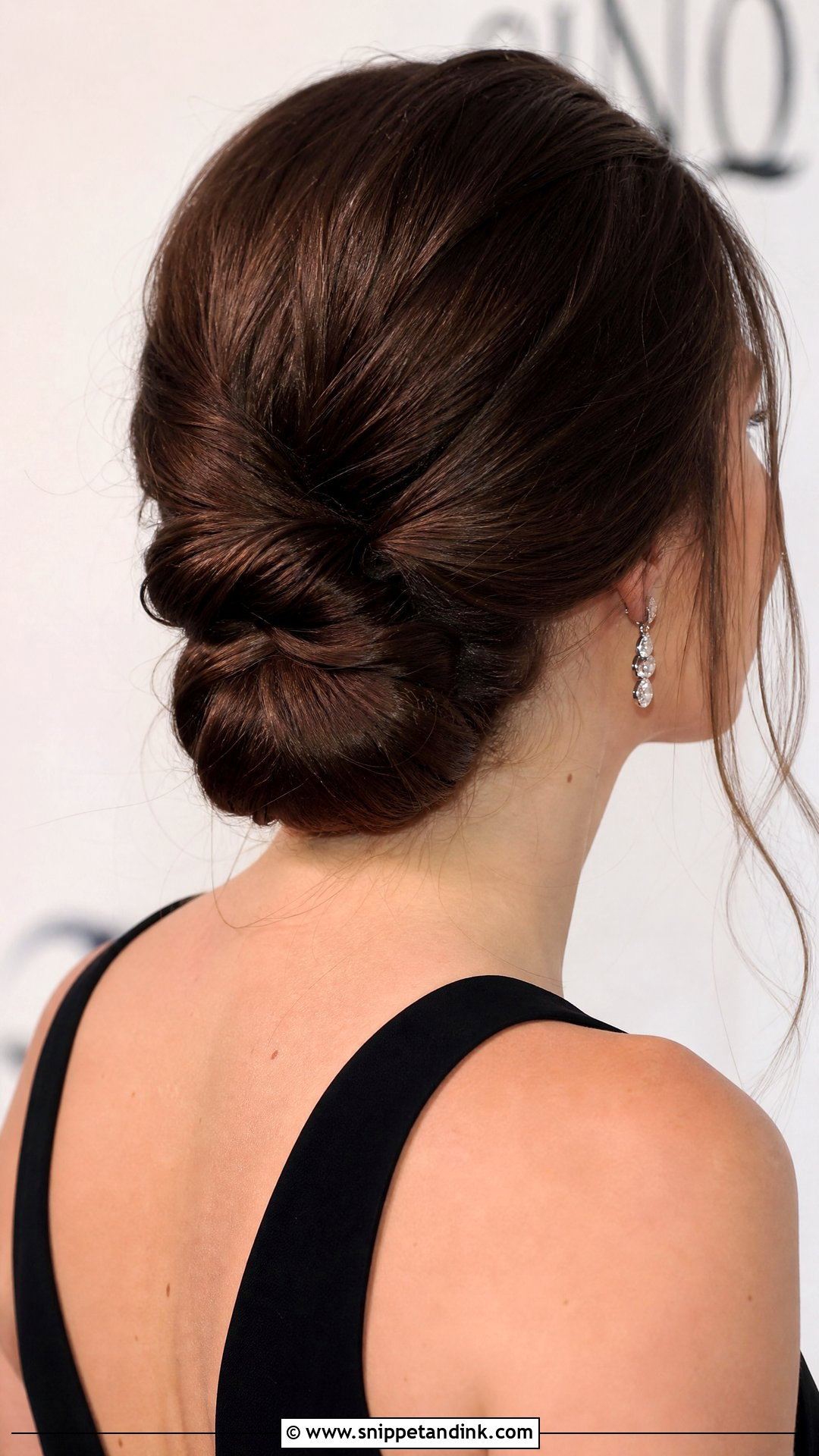 Twisted Low Chignon - Snippet and Ink - 20 Wedding Guest Hairstyles for Medium Hair