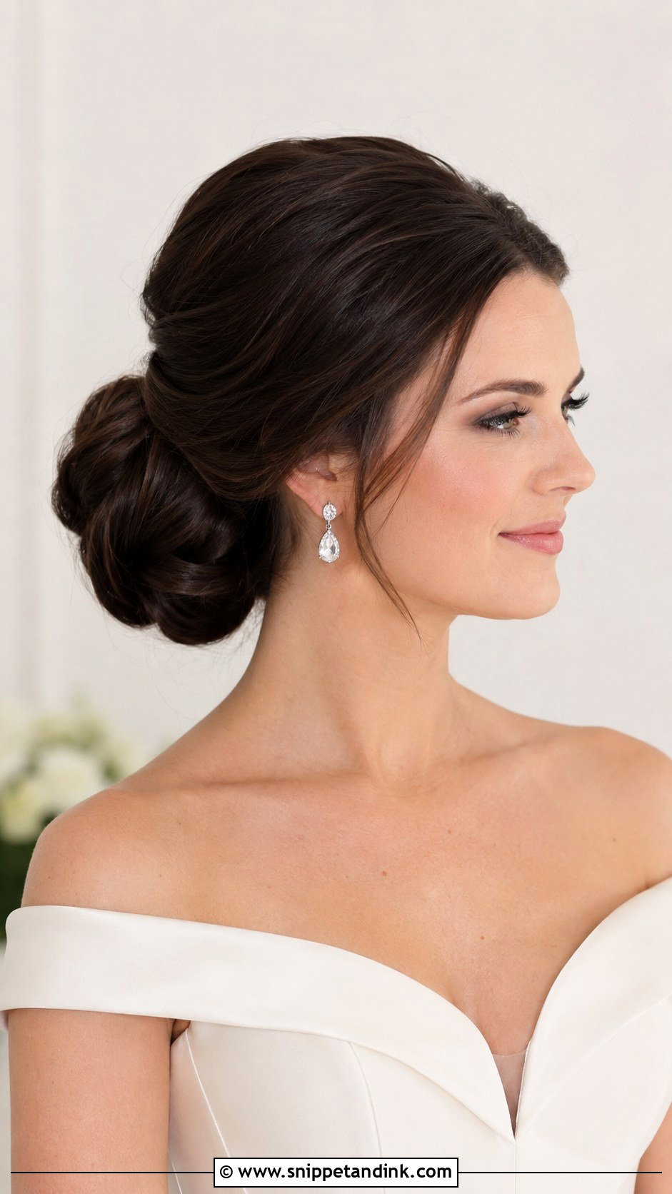 Voluminous Brunette Low Bun Wedding Hair - Snippet and Ink - 15 Low Bun Brunette Wedding Hair Ideas