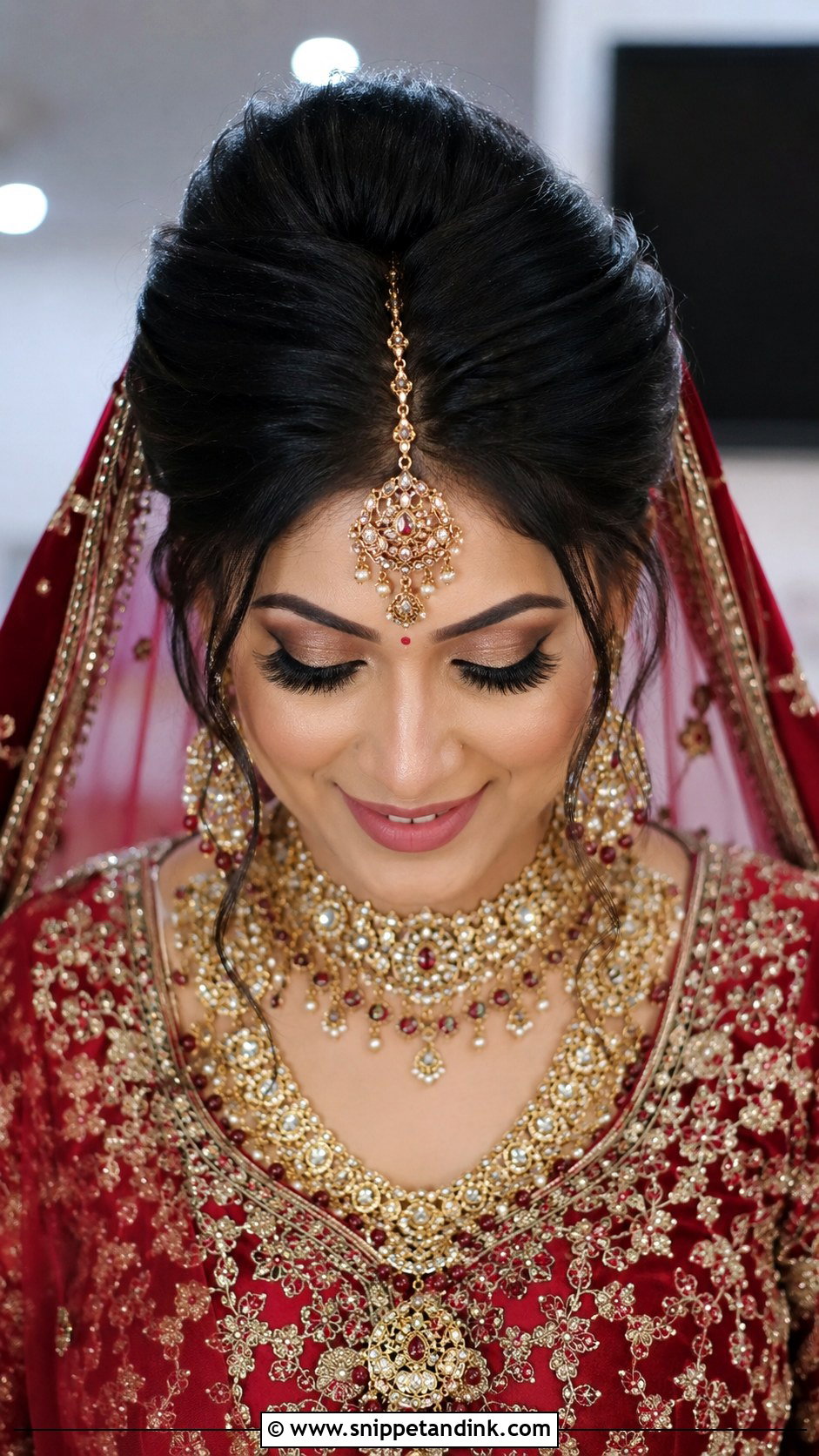 Voluminous Bun With Maang Tikka - Snippet and Ink - 25 Indian Front Look Bridal Bun Hairstyles