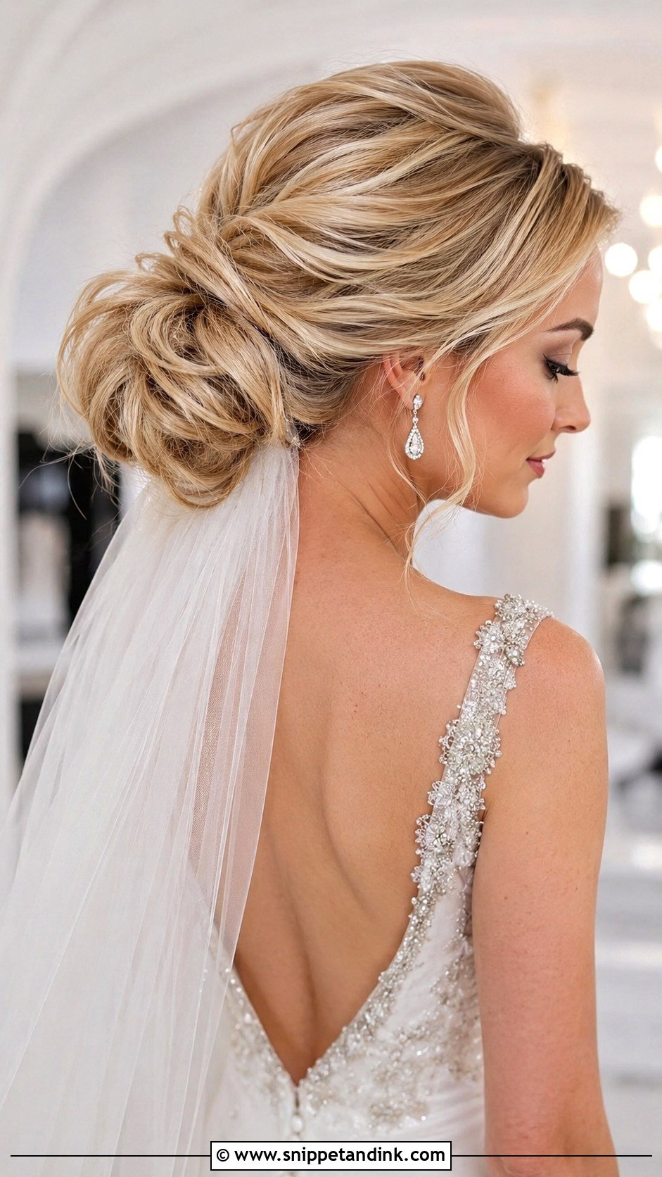 Voluminous Low Bun - Snippet and Ink - 35 Low Bun Wedding Hair Ideas