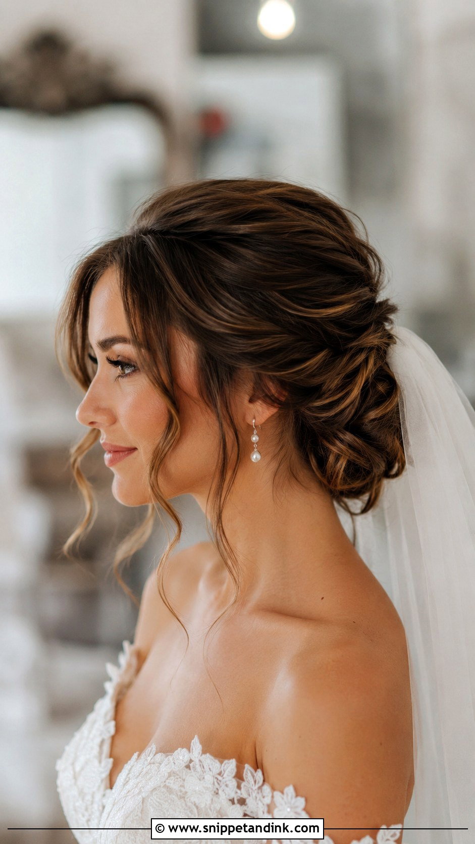 Wavy Low Bun With Loose Tendrils - Snippet and Ink - 20 Wavy Wedding Hairstyles
