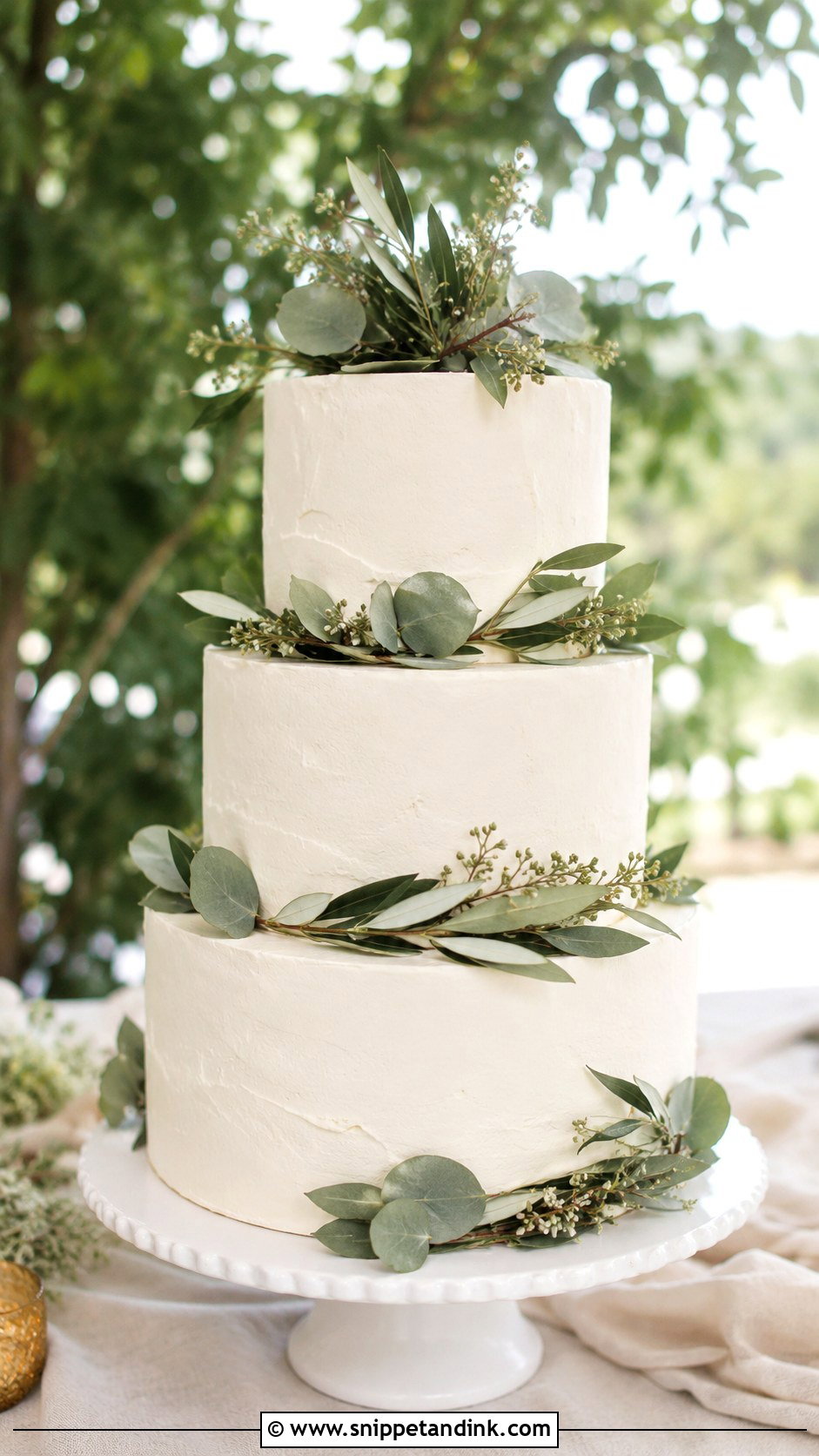White 3 Tier Wedding Cake With Greenery - Snippet and Ink - 25 Simple White 3 Tier Wedding Cake Ideas