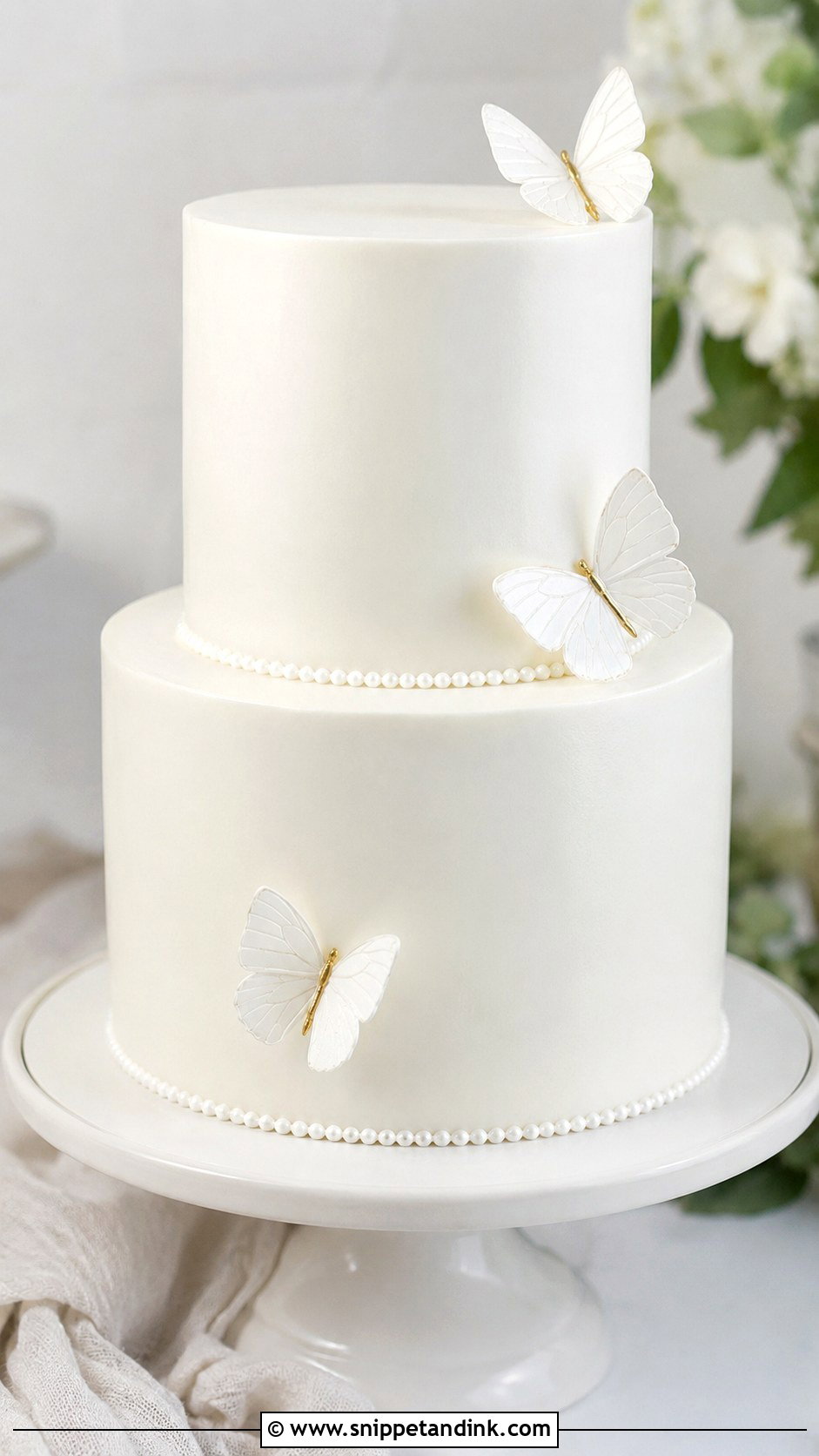 White Butterfly Wedding Cake With Tall Tiers - Snippet and Ink - 20 White Cake Ideas with Butterflies for Wedding