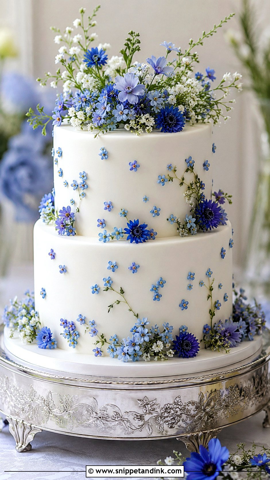 White Wedding Cake With Blue Wildflowers - Snippet and Ink - 20 White Wedding Cake Ideas with Wildflowers