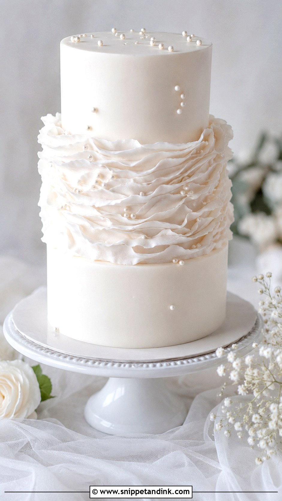 White Wedding Cake With Ruffles - Snippet and Ink - 20 Minimal White Wedding Cake Ideas