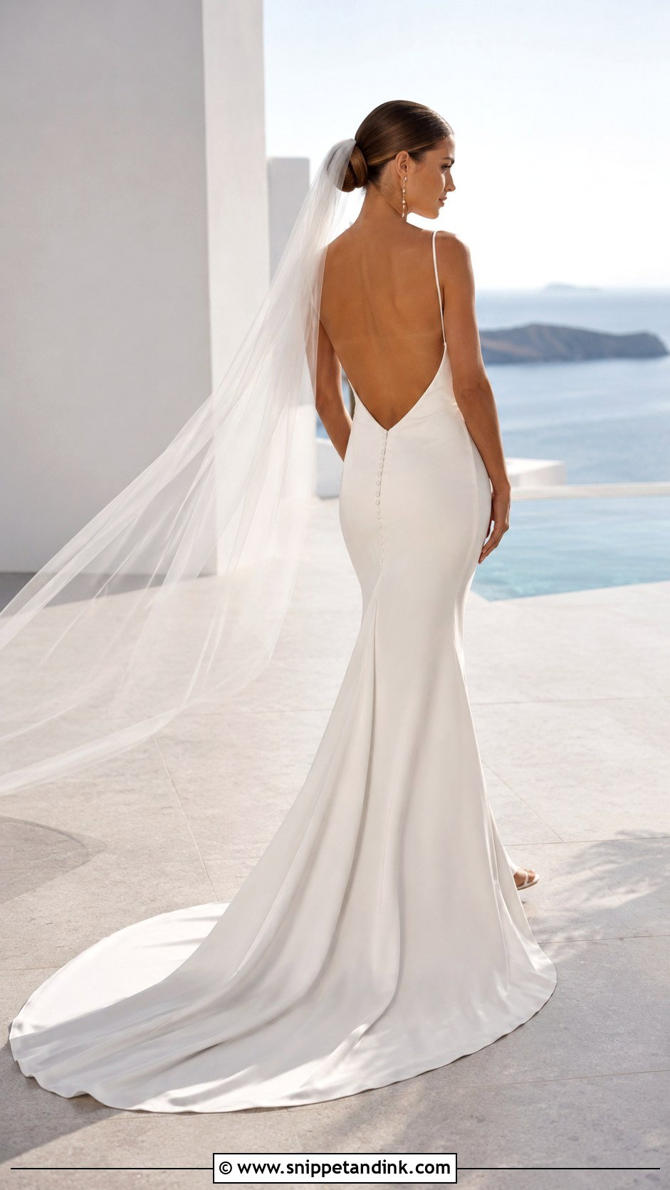 Backless KYHA Wedding Dress With Drop Earrings - Snippet and Ink - 20 Khya Studios Wedding Dress Ideas