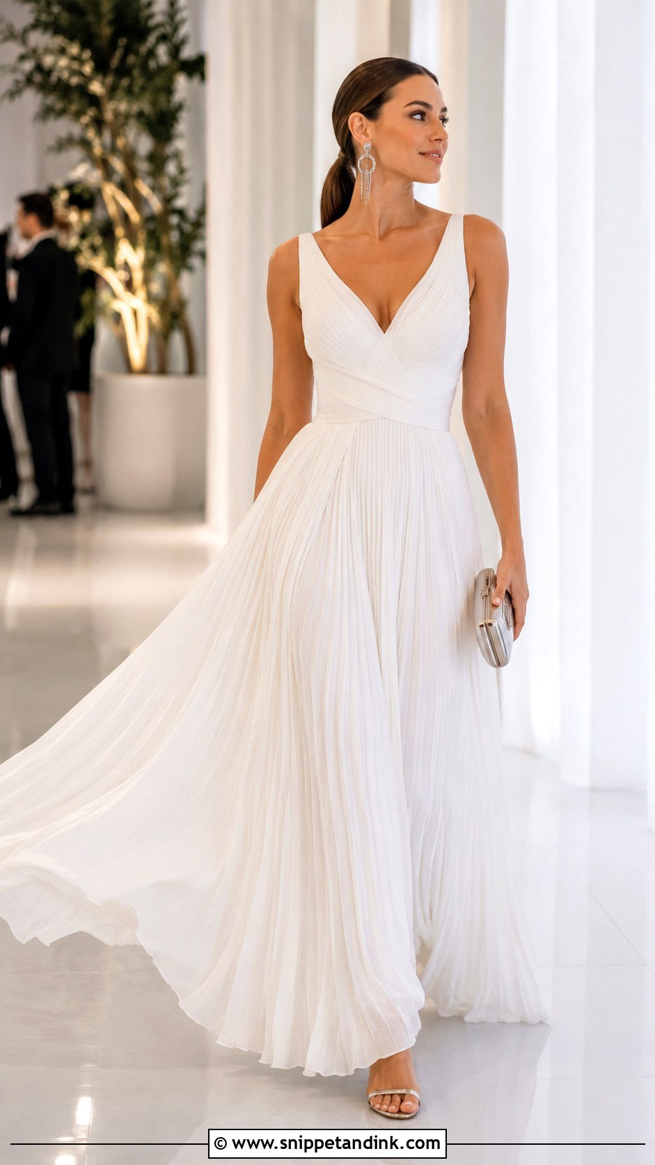 Long White Pleated Gown With Silver Accessories - Snippet and Ink - 20 Long White Gown Ideas